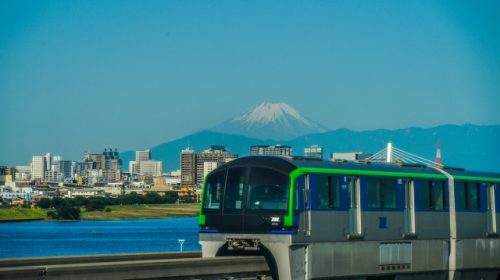 Tokyo Monorail type 10000 train running with Mt. Fuji in the background
